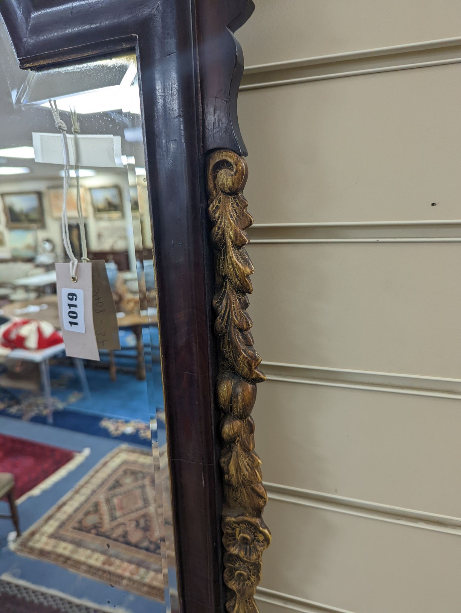 An early 20th century George III style parcel gilt fret cut mahogany wall mirror, width 59cm, height 112cm